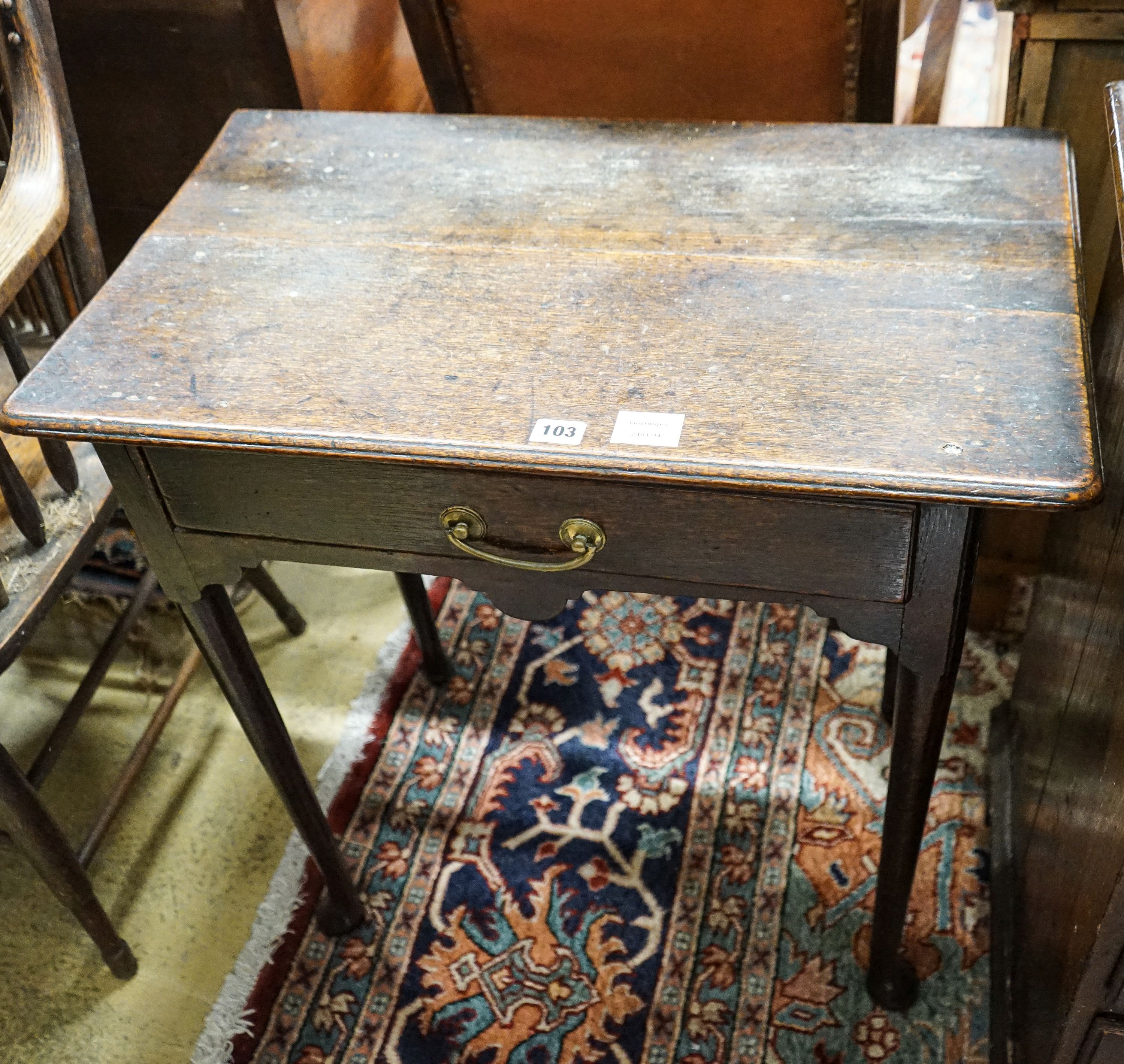 An early 18th century oak lowboy, with single drawer on slender turned legs with pad feet, width 69cm, depth 40cm, height 68cm